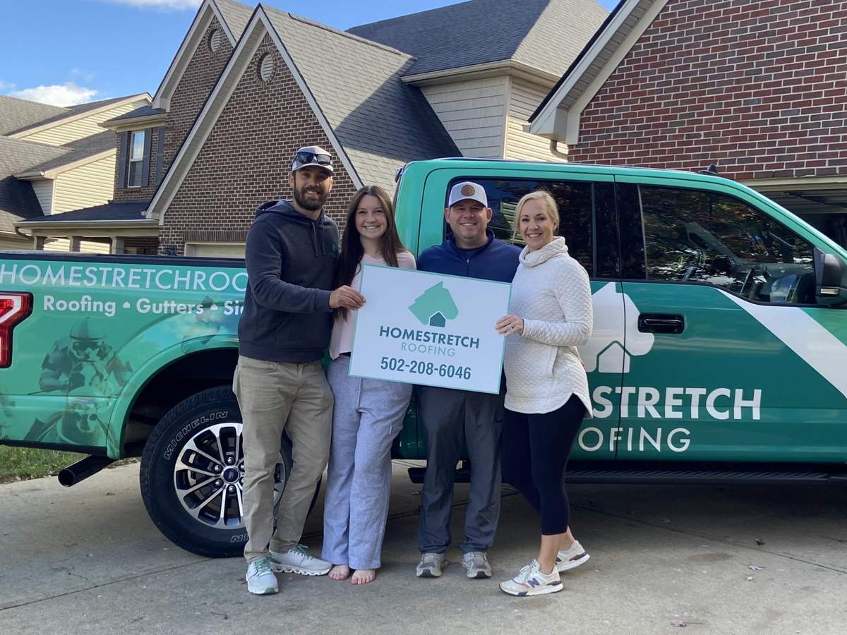 Homestretch Roofing team celebrating with customers